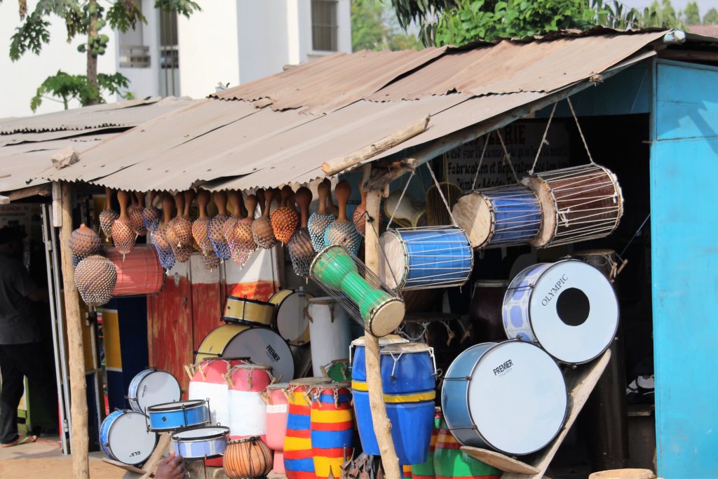 This photo shows drums and other percussion instruments for sale outside a shop in Lome
