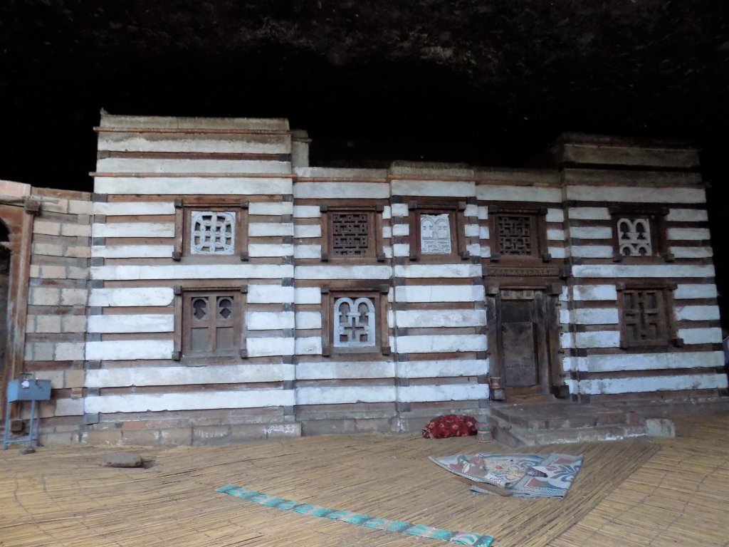 This photo shows the distinct wood and stone layers used in the construction of Yemrehanna Kristos