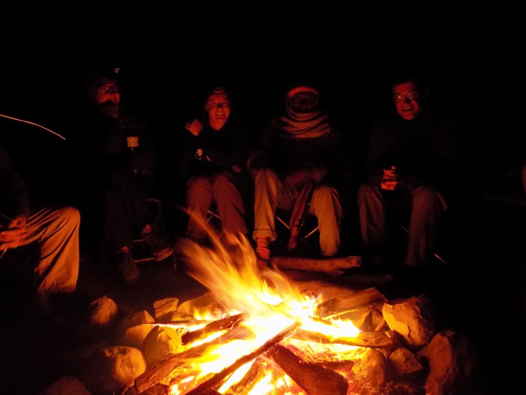 This photo shows our campfire with members of our group and our guards sitting around telling stories