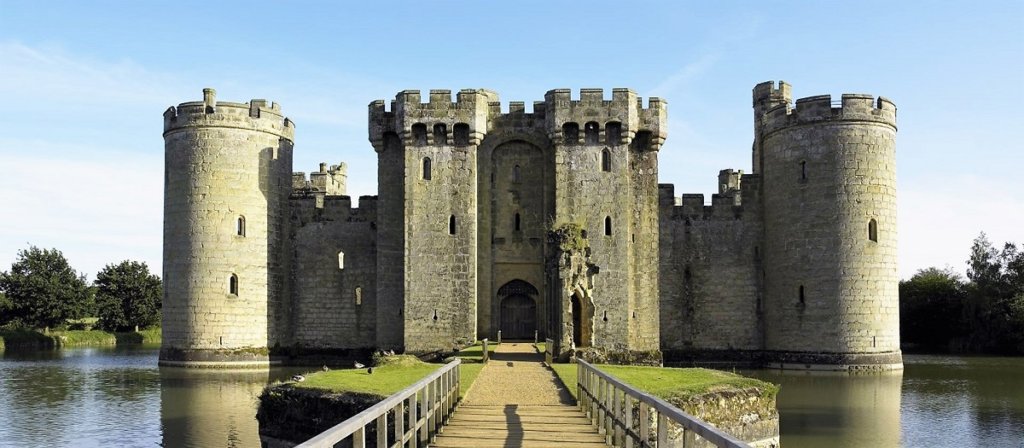 This photo shows the front of Bodium Castle with a bridge across the moat