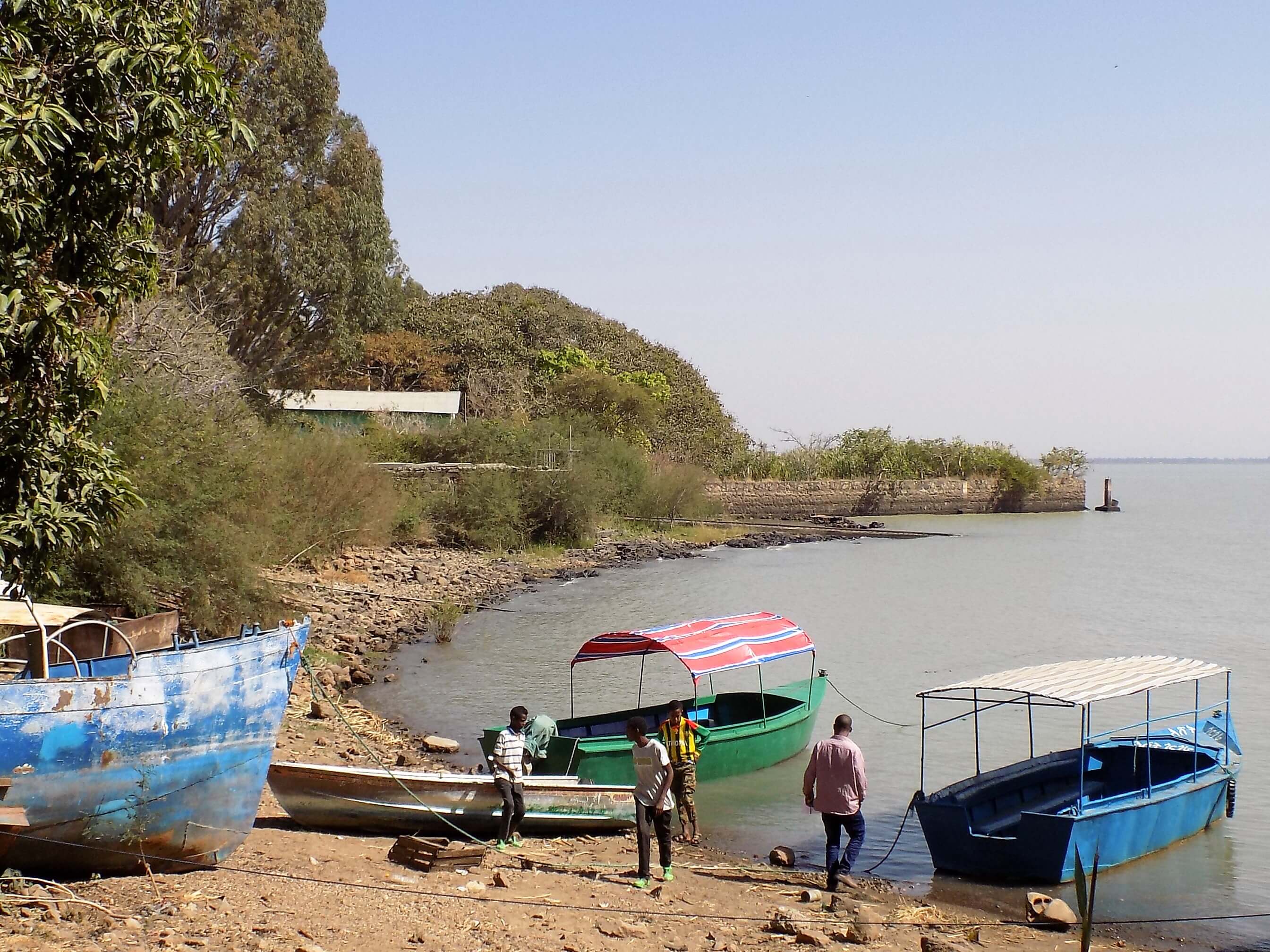 This photo shows a few small boats on the shores of Lake Tana at Gorgora.