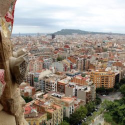 This photo shows the view of Barcelona from the Passion Tower including a decorative detail on the tower itself