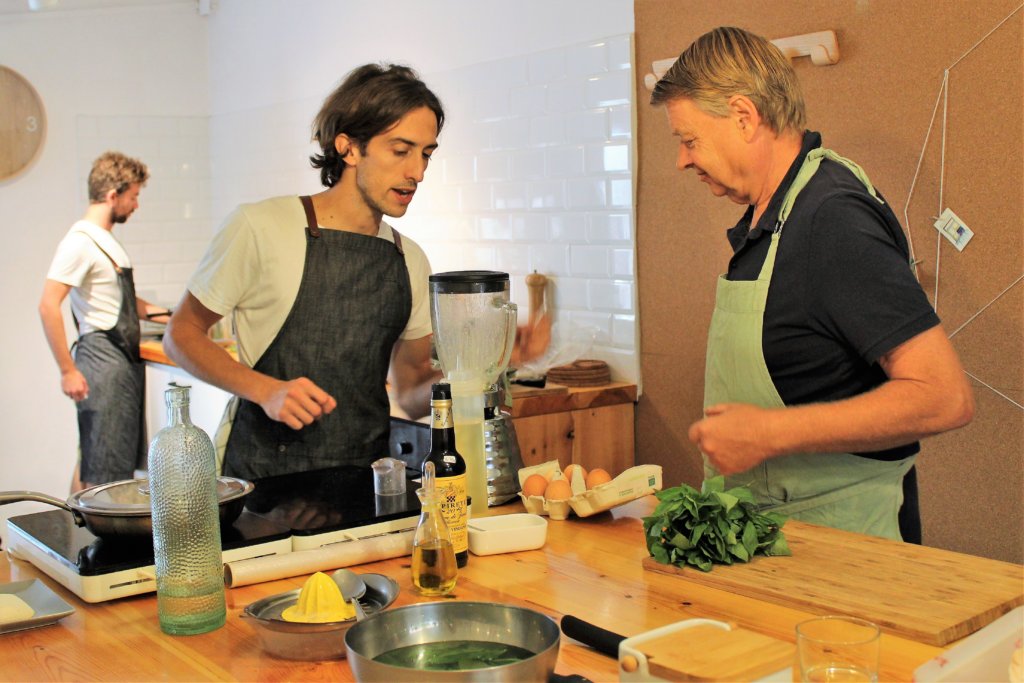 This photo shows Alberto, our Barcelona-based Italian chef, showing Mark how to make basil mayonnaise