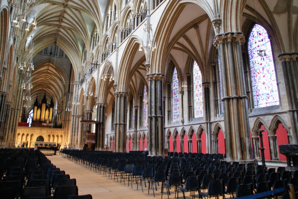 This photo shows the impressive interior of Lincoln Cathedral with its towering Gothic arches