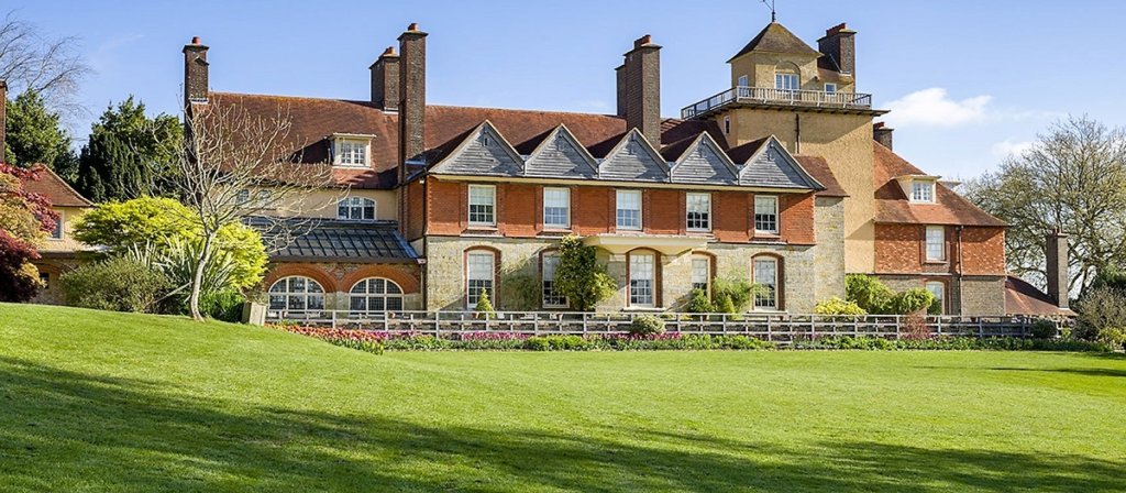 This picture shows Standen with lovely manicured lawns in front