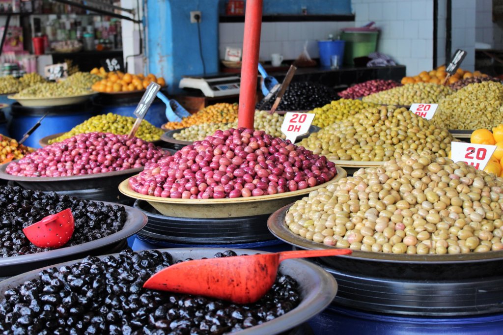 This photo shows bowls of colourful olives on sale