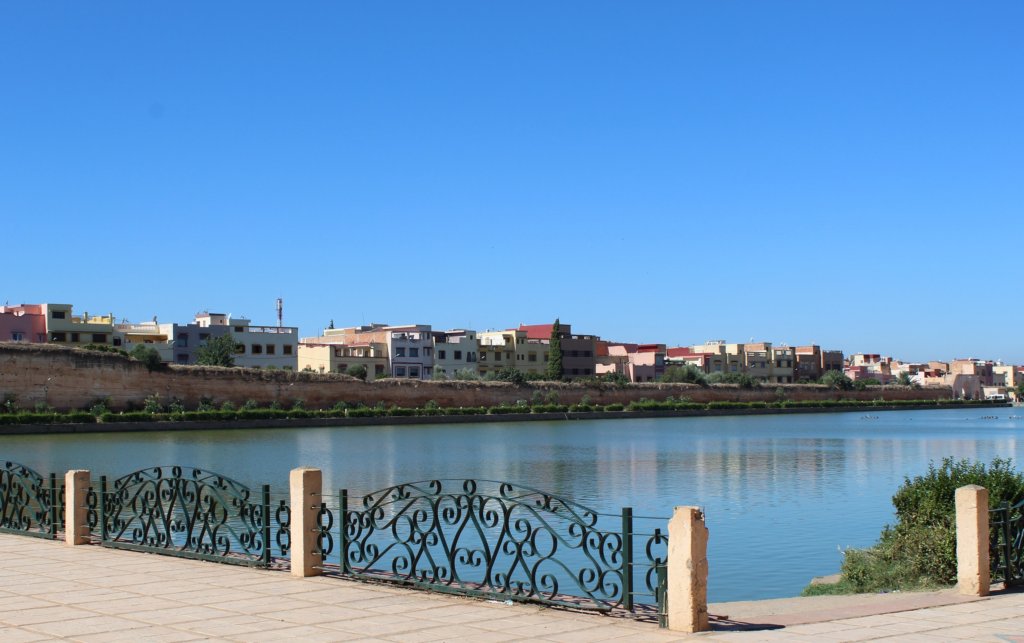 This photo shows the reservoir full of water set against a brilliant blue cloudless sky