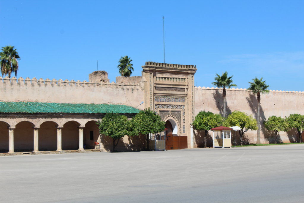 This photo shows the square and the ornate entrance to the Mausoleum of Moulay Ismail