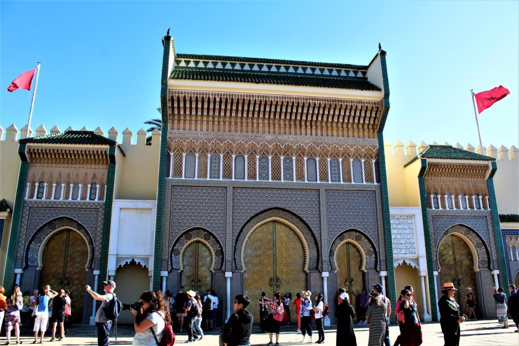 This photo shows the impressive entrance to the Royal Palace in Fez with its brass doors and decorative surround