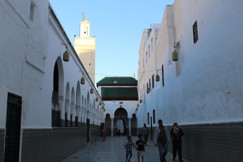 This photo shows the Mausoleum of Moulay Idriss as seen through the bars of the entrance gate