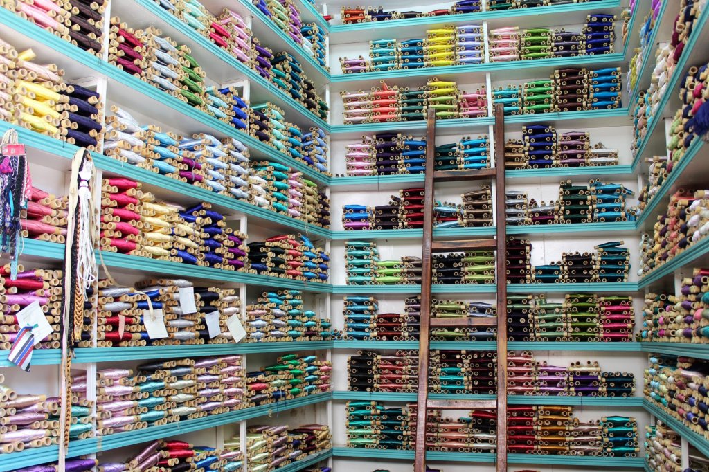 This photo shows shelves full of coloured silk threads