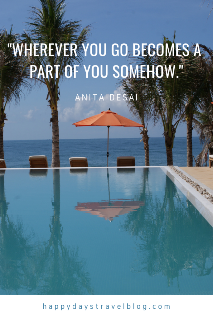 This photo shows a swimming pool with the ocean beyond and the travel quote, 'Wherever you go becomes a part of you somehow' by Anita Desai