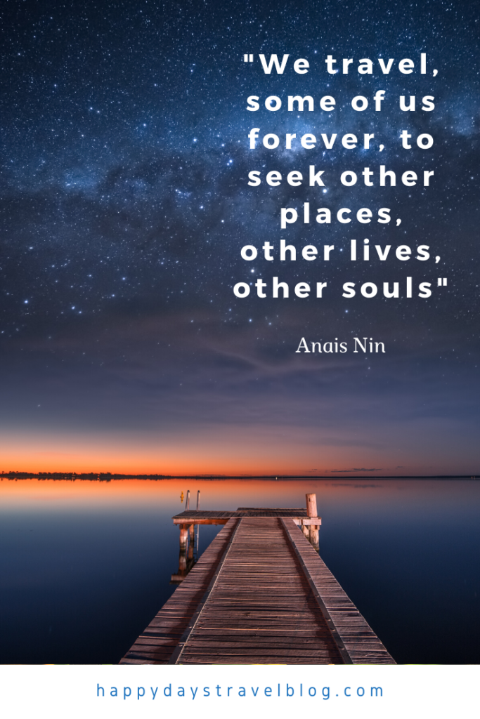 This photo shows a wooden pier and a quote by Anais Nin, 'We travel, some of us forever, to seek other places, other lives, other souls.'