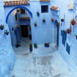 This photo shows a dead end in Chefchaouen medina. All of the walls of the buildings are painted blue