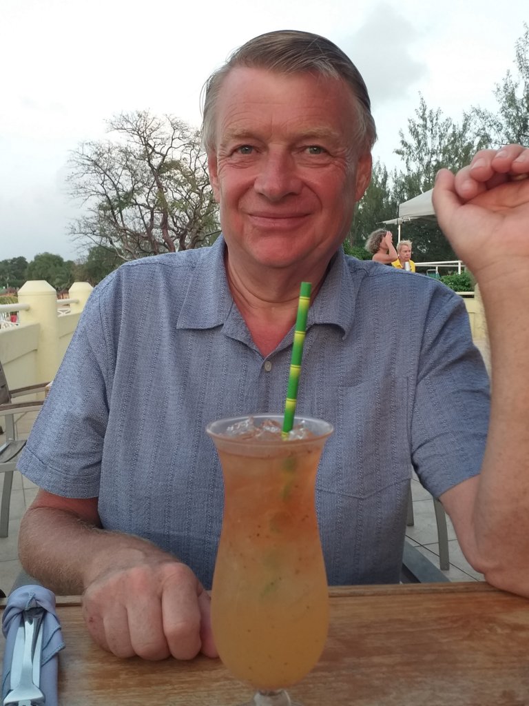 This photo shows Mark about to drink a rum punch - he's looking very pleased with himself!