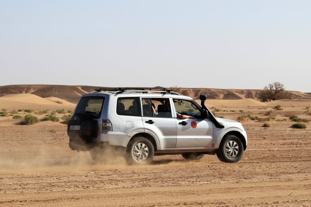 This photo shows a 4WD speeding across the desert