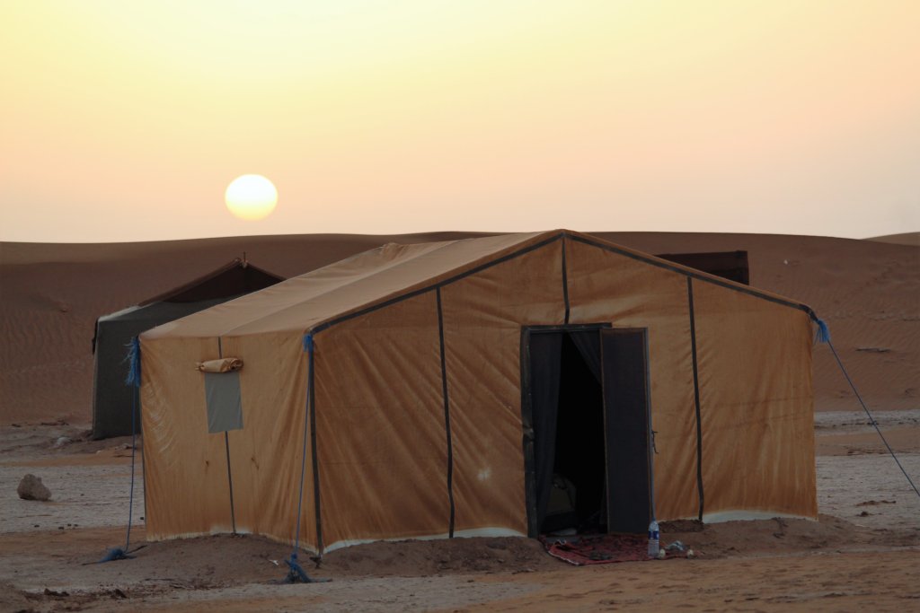 This photo shows the sun rising behind our tents