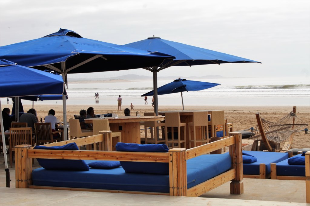 This photo shows sofas and beach umbrellas