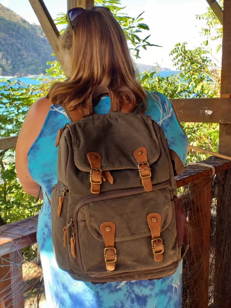 This photo shows me standing on our deck looking out to sea with my backpack on my back