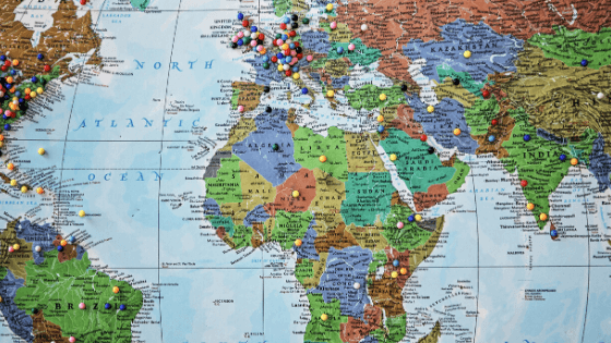 This picture shows a world map with pins in various locations