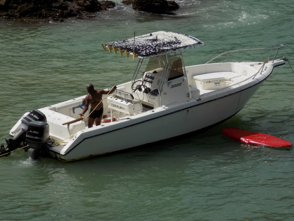 This photo shows Richie in a wet suit on his boat