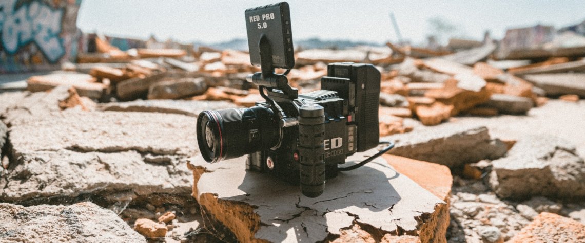 This photo shows a video camera sitting on some rocks.