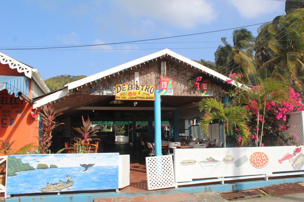 This photo shows the front of a brightly-painted wooden bistro