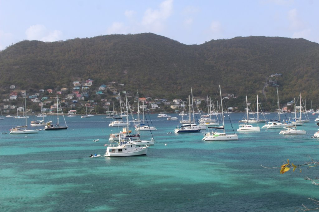 This photo shows yachts moored in turquoise blue sea