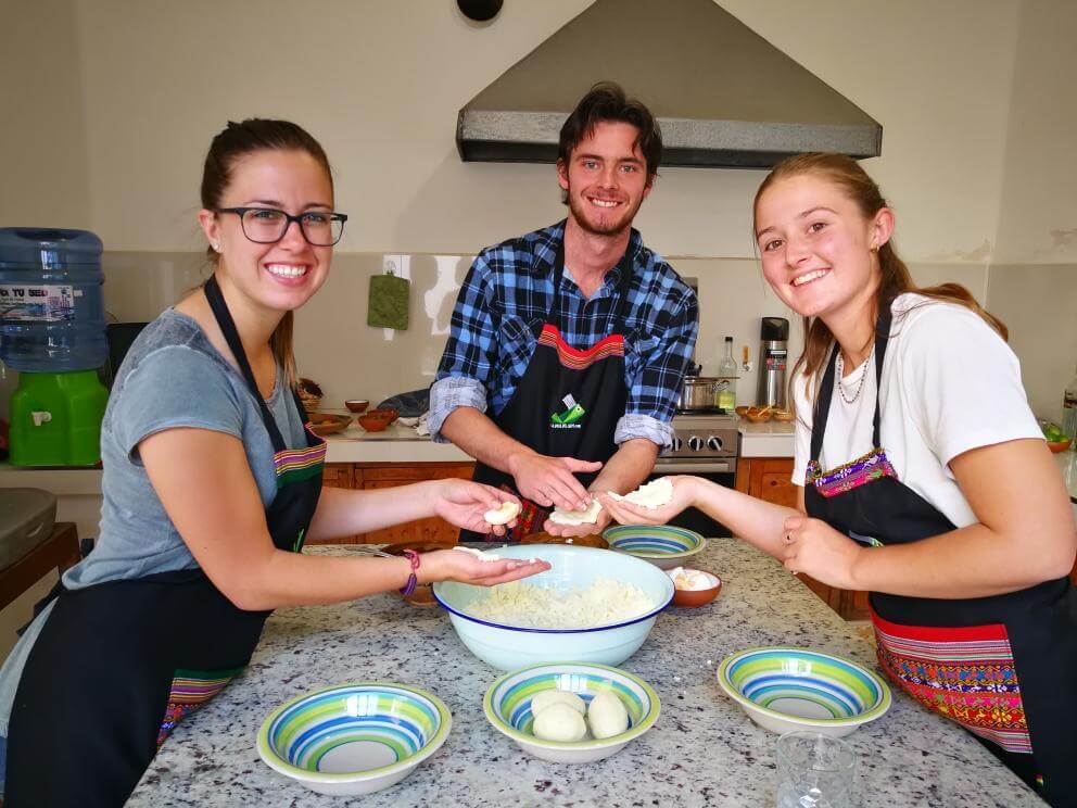 This photo shows 3 people enjoying a cooking class