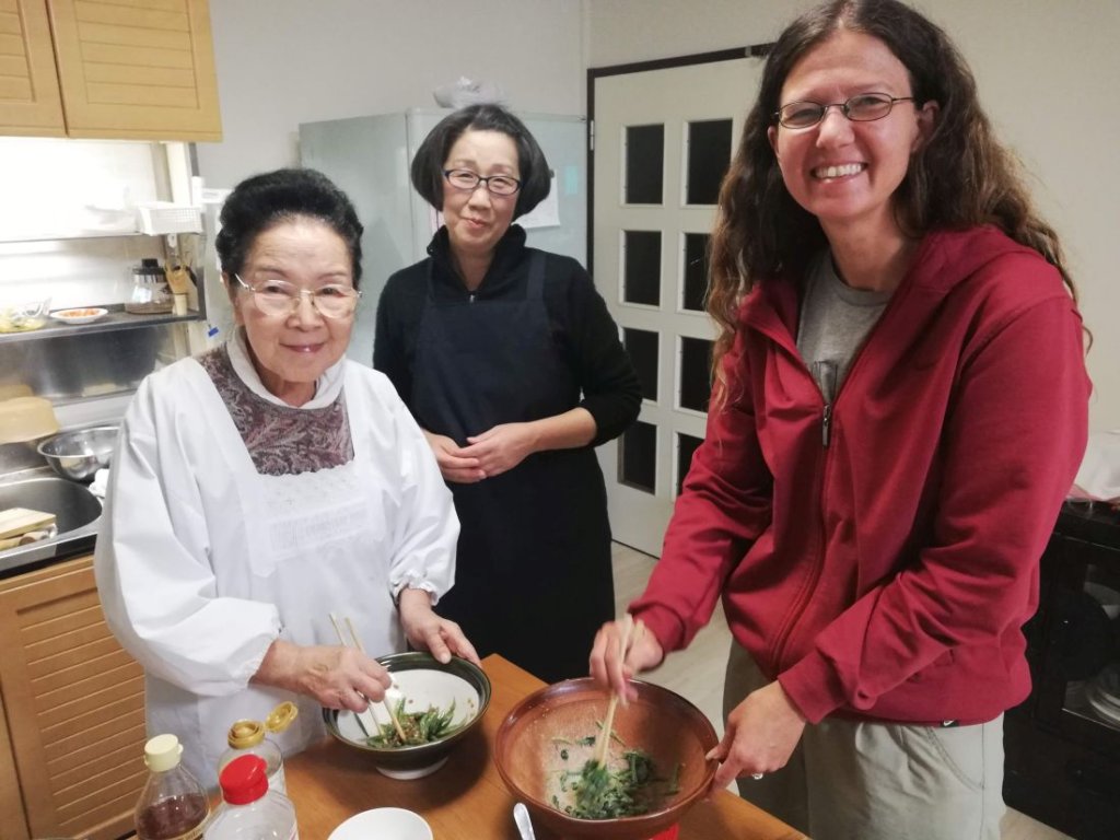 This photo shows students being taught how to cook Japanese food