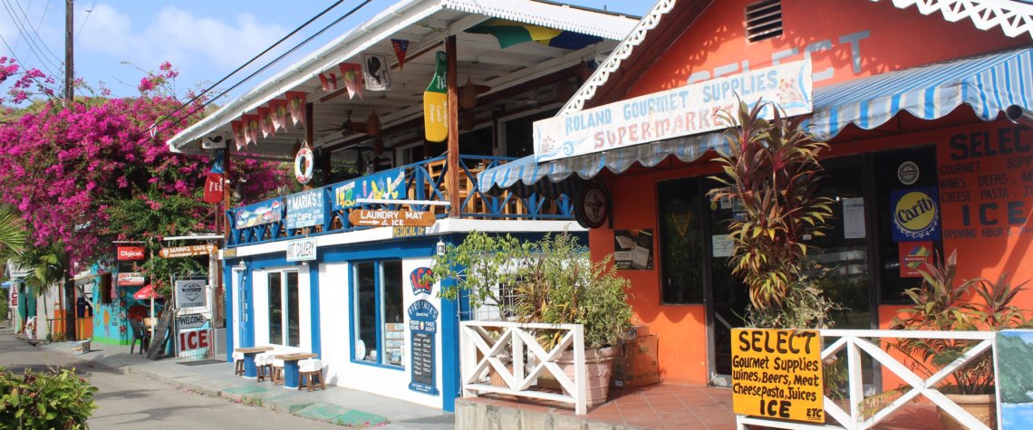 This photo shows the main promenade with its brightly-painted shops and restaurants