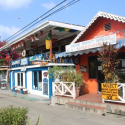 This photo shows the main promenade with its brightly-painted shops and restaurants