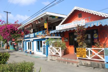This photo shows the main promenade with its brightly-painted shops and restaurants