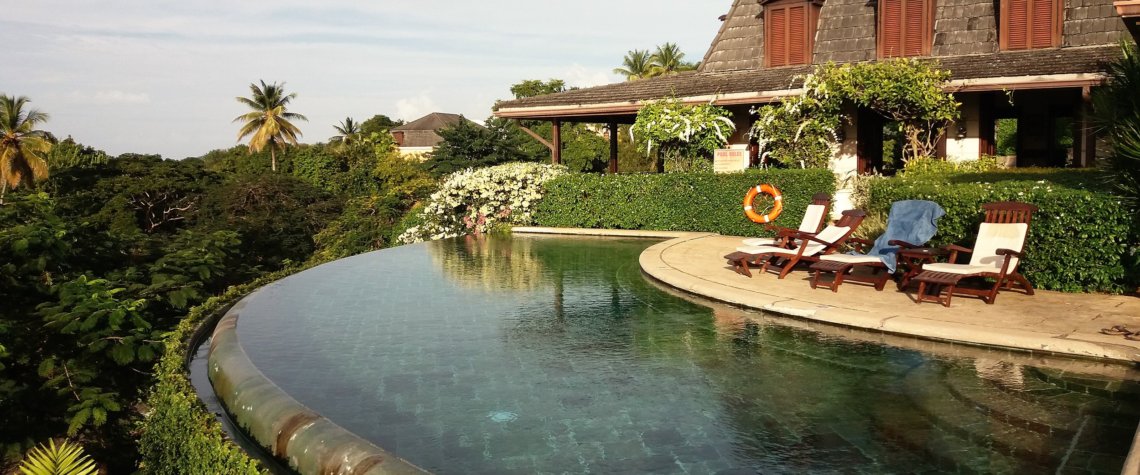 This photo shows the infinity pool with the restaurant behind.