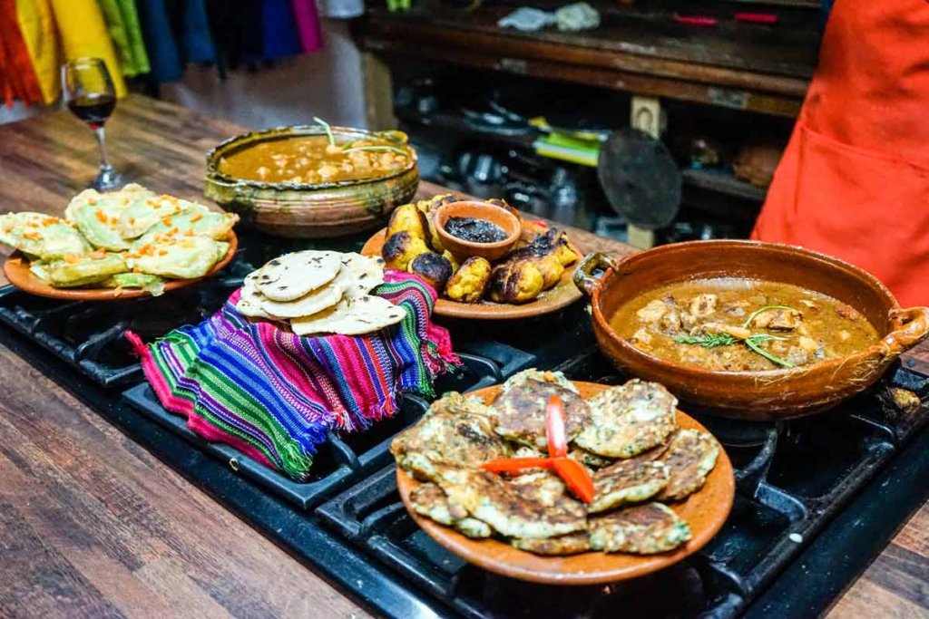 This photo shows an array of dishes arranged on a cooker top
