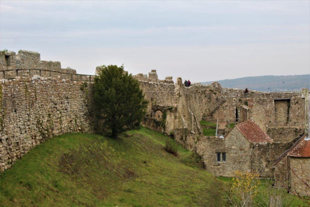 This photo shows the ancient stone walls of the castle on a moody grey day.