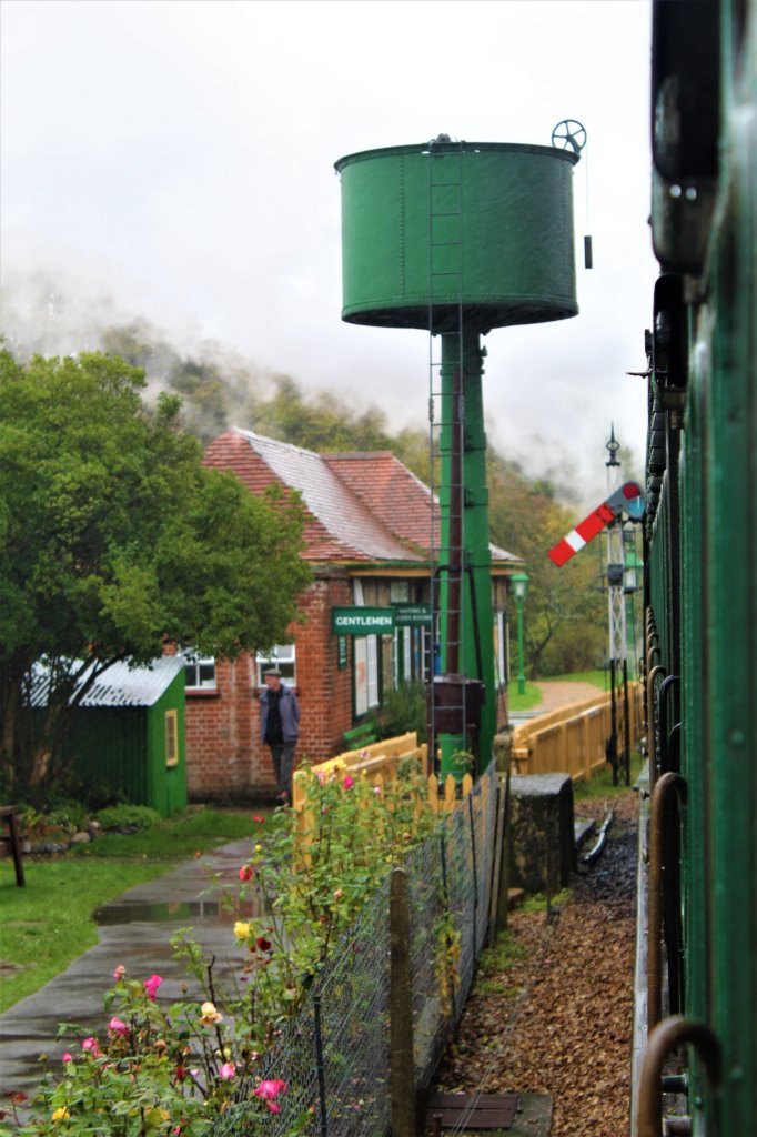 This photo shows a green water tank next to the track