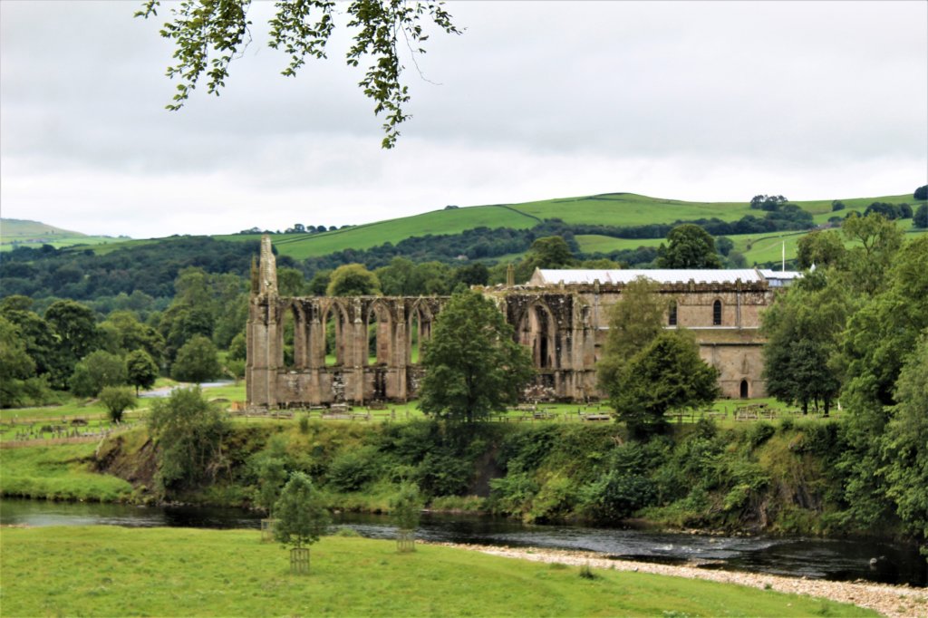 This photo shows the ruins of Bolton Priory seen from across the river