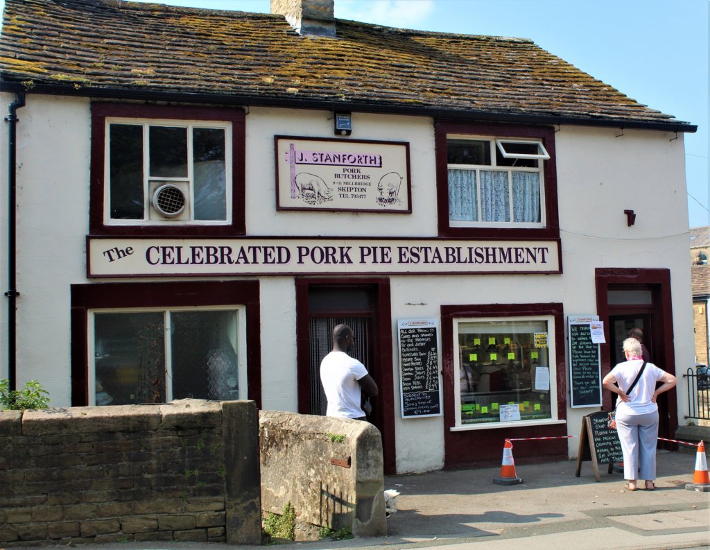 This photo shows a traditional butcher's shop with old tiled roof