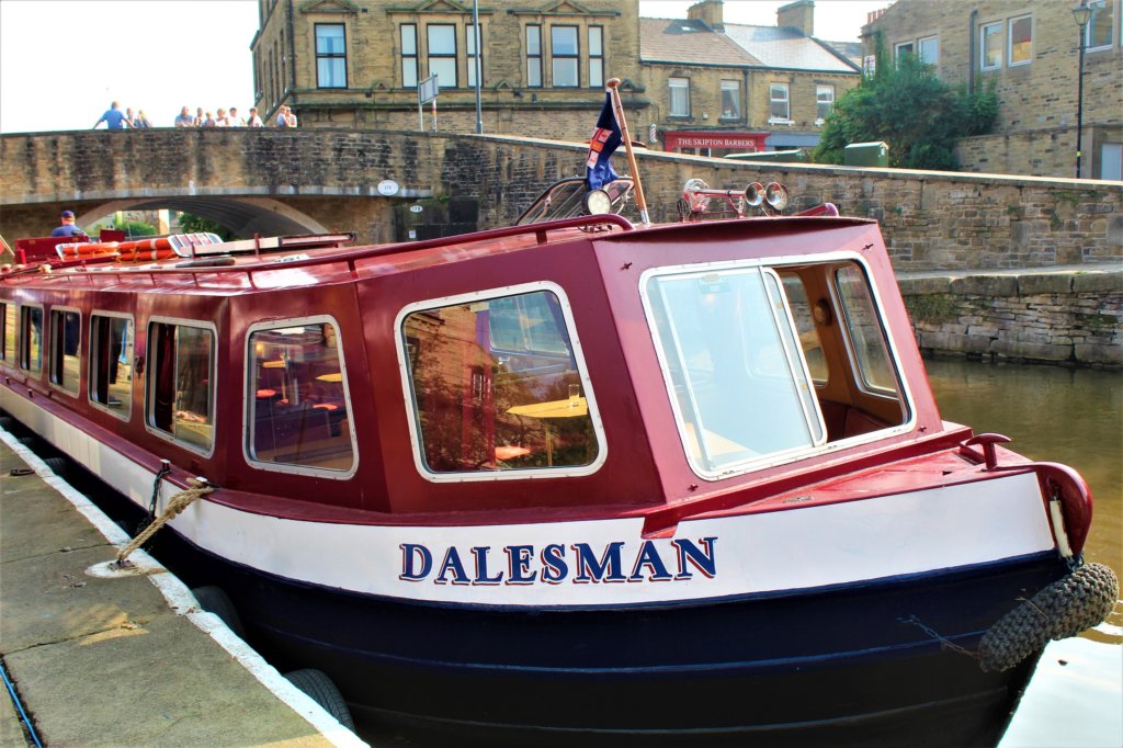 This photo shows the front of the barge we went on. It's painted in red and blue.