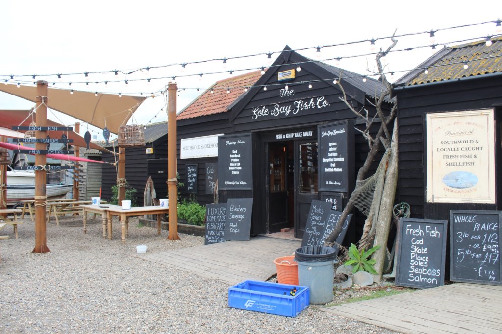 This photo shows the black building of the fish company