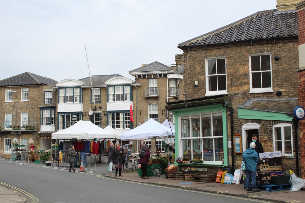 One of the best things to do in Southwold is to go shopping. Tjhis photo shows market stalls set up in the High Street.