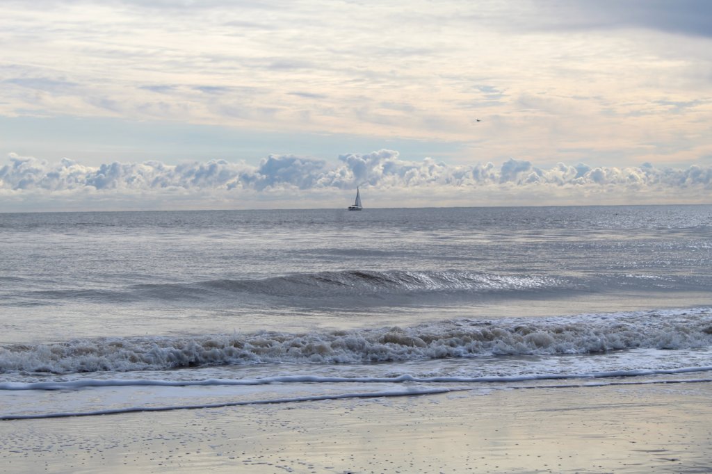 This photo shows the morning sun reflecting off the sea at Southwold Beach