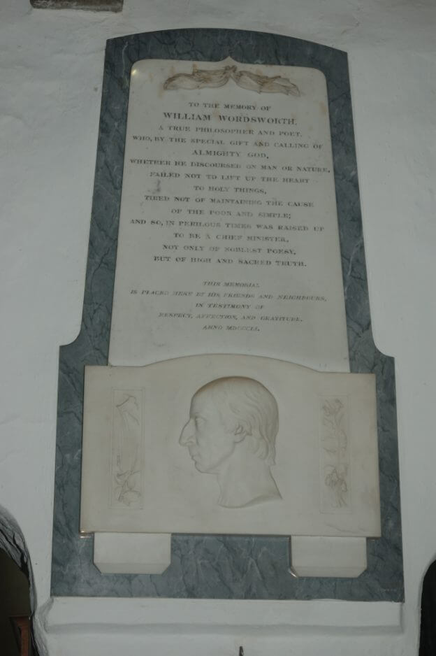 This photo shows the wall-mounted marble memorial to Wordsworth found inside St Oswald's Church Grasmere