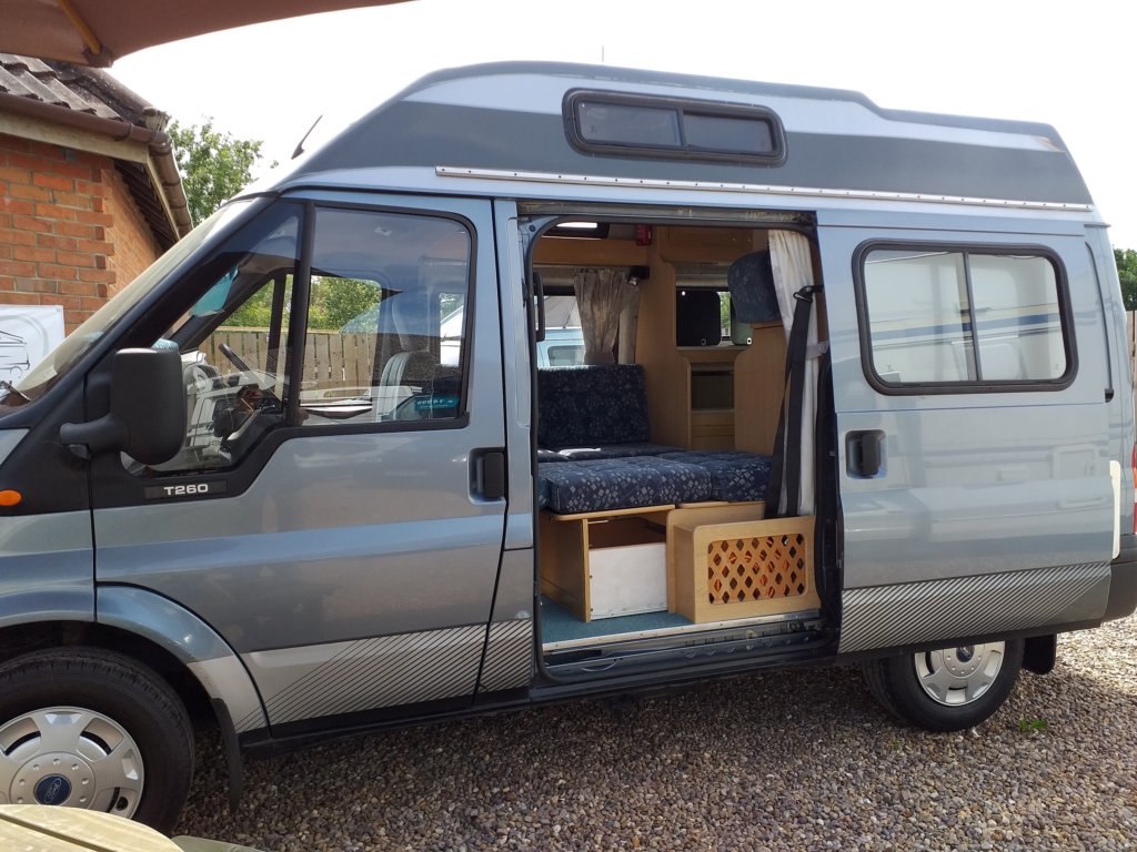 This photo shows our campervan side on, with the sliding side door open
