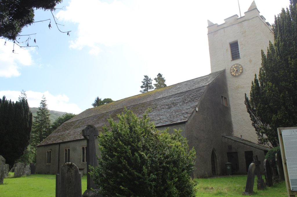 This photo shows St Oswald's Church complete with tower and clock