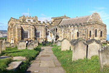 This photo shows the south side of the church with graves in the foreground