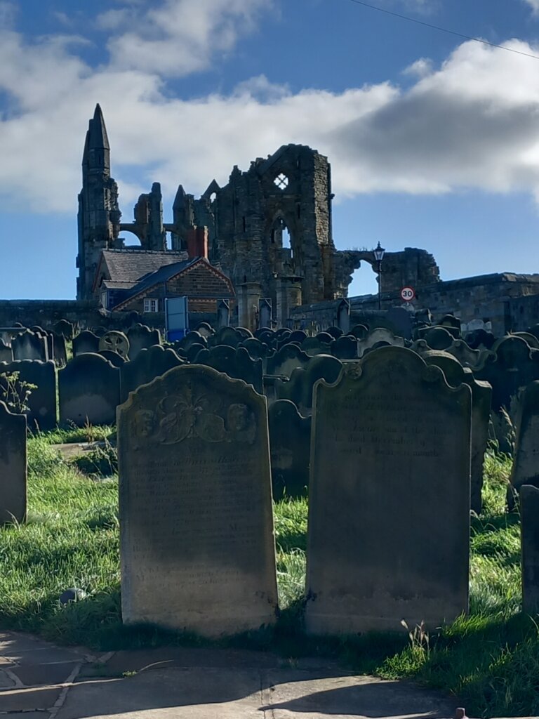 The graveyard of St Mary's with Whitby Abbey in the background