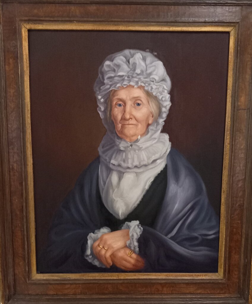 This photo shows a portrait of Mrs Elizabeth Cook