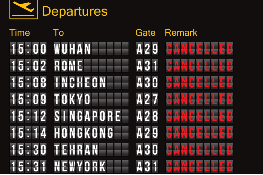 This photo shows an airport departure board with lots of cancelled flights to destinations like New York and Singapore
